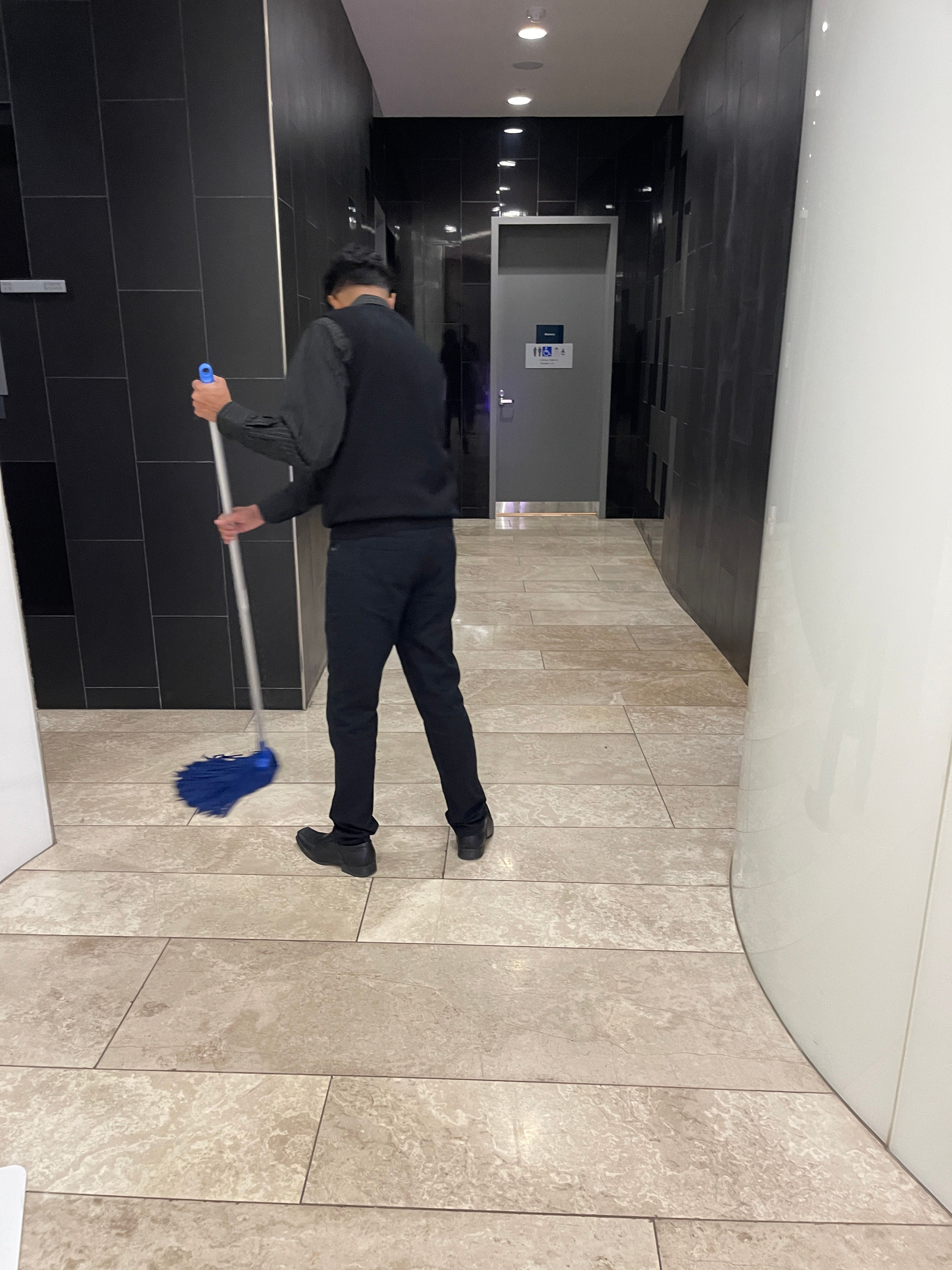 A Zavvers cleaner caring for a workplace shared-area floor